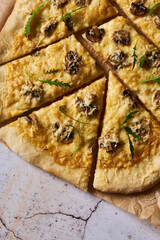 Pizza with white sauce and champignons