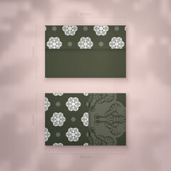 Business card in dark green color with abstract white ornament for your brand.