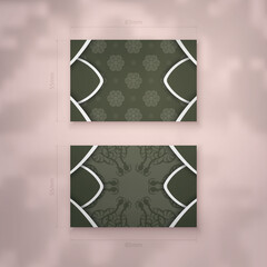 Business card in dark green color with vintage white ornament for your business.