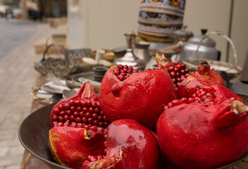 Red pomegranates in a street shop. Baku. Old city. Azerbaijan.