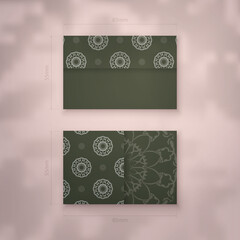 Business card template in dark green color with Indian white pattern for your brand.