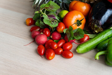 Fruits and vegetables on a wooden table. Organic vegetables variety in wood board.