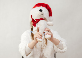 New Year's holiday. Portrait of a little girl with a Christmas style and gifts.