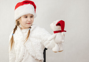 New Year's holiday. Portrait of a little girl with a Christmas style and gifts.
