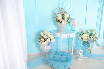 Decorations in the room in a soft blue shade gifts and flowers