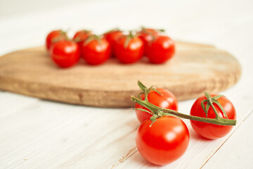 Ingredients Cherry tomatoes on a cutting board wood background