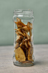 A jar filled with banana peel cuts and water. Banana peel for plant fertilization. Eco friendly natural way of fruit waste compost. Banana peel compost