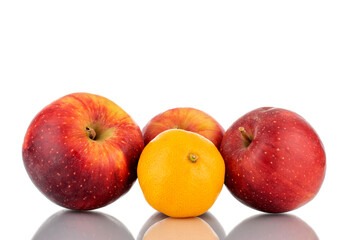 One sweet tangerine and three red ripe apples, close-up, isolated on white.