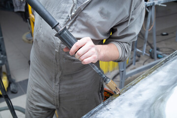 Preparation for painting the car door.Car body repair. Preparation for painting car parts.