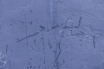 Abstract background of damaged cracked blue plaster.