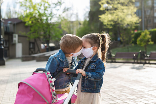 Children kiss in protective face masks. Coronavirus, covid-19