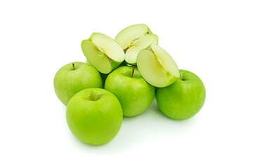 fresh mellow juicy green apple half-cut and pieces on the white floor