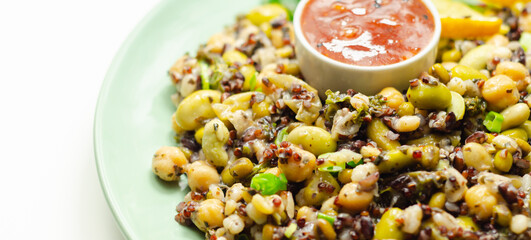 Cooked edamame beans, chickpeas, pearl barley, red quinoa, mung beans and black rice in a refreshing lemon dressing