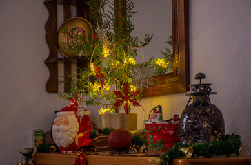 christmas tree with christmas decorations in kitchen