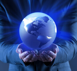 Businessman holding globe in global business concept