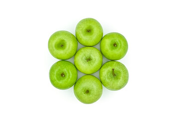 Top close-up view green apples 7 appetizing green apples on the white surface