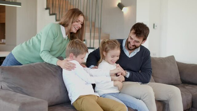 Siblings fighting over TV remote control at home