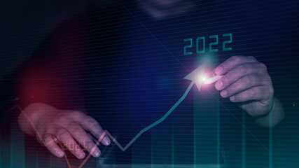 Businessman pointing arrow graph corporate future growth plan. Business development to success and growing growth year 2021 to 2022 concept