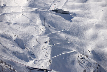 gondola lift station and ski slopes, Saas Fee resort in Swiss Alps, Valais, Wallis, Switzerland, Europe