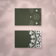 Dark green business card template with Greek white ornaments for your brand.