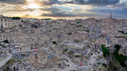 Fototapeta premium Aerial view of the ancient town of Matera (Sassi di Matera) at sunset. Basilicata, southern Italy