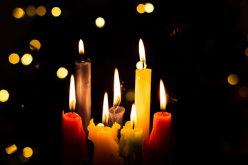 Candlelight Day. Traditional Colombian holiday. Group of candles lit at night with unfocused lights in the background.