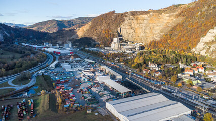 Aerial view of Peggau during autumn with the huge stone pit, cement plant and waste disposal industry