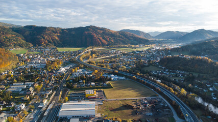 Aerial view of Peggau during autumn with the beautiful rock face Peggauer Wand
