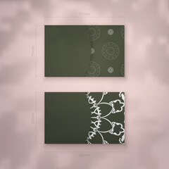 Dark green color business card template with greek white pattern for your brand.