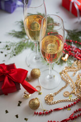 Christmas. Champagne glasses.  panettone, tree with golden balls and garland.