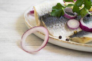 delicious herring, blue onion parsley
