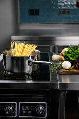 Pasta in a pan in the kitchen of a restaurant
