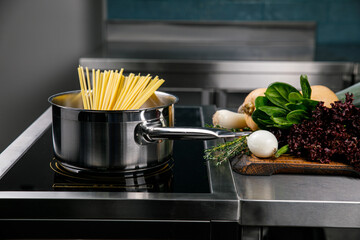 Pasta in a pan in the kitchen of a restaurant
