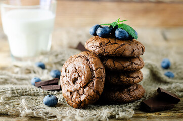 Chocolate brownie cookies with berries and mint leaves