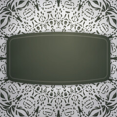 Greeting card in dark green color with Indian white ornaments for your design.