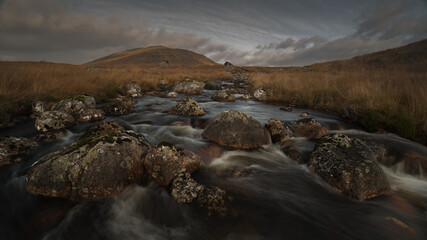 Mountain stream with mountain in the background. © Jaroslaw
