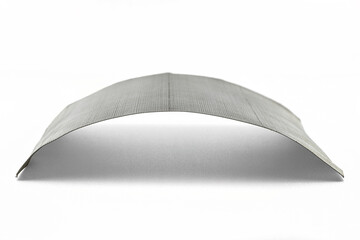 Macro photo of a fine metal mesh used for water filtration, isolated on a white background.