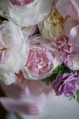 Beautiful flowers. Preserved roses with dried flowers bouquet closeup. Beautiful flower arrangement in a pink box.