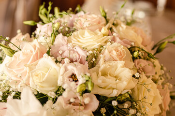 wedding bouquet of roses and lilies on a table 