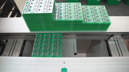Production of high techonology circuit board. Close up making circuit board.	
