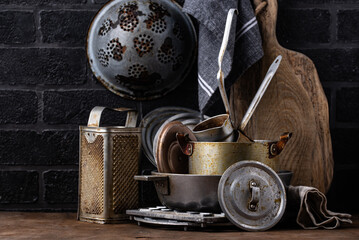 Old vintage iron pots and metallic dish