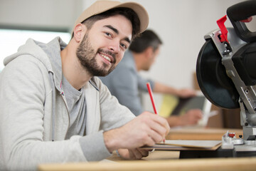 young carpenter is in school
