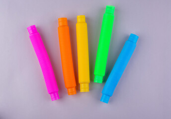 Different pop tubes. Trendy antistress toy
