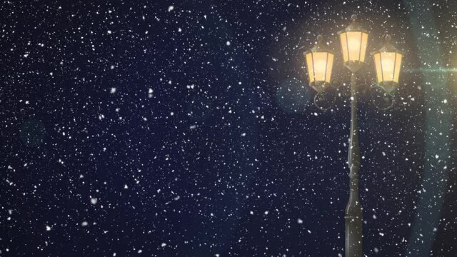 Animation of snow falling and street lamp at christmas