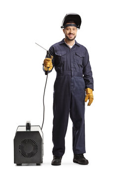 Full length portrait of a man in a uniform holding a welding generator and smiling