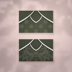 Presentable business card in dark green color with Greek white pattern for your contacts.