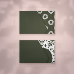 Presentable dark green business card with vintage white ornaments for your personality.
