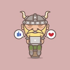 cute cartoon viking playing social media on laptop. vector illustration for mascot logo or sticker