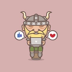 cute cartoon viking playing social media on laptop. vector illustration for mascot logo or sticker