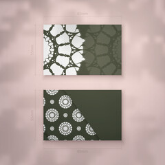 The business card is dark green in color with a luxurious white ornament for your contacts.